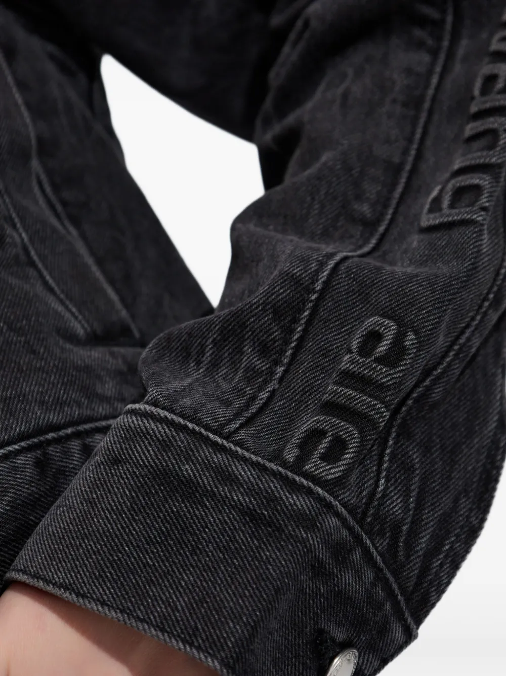 Close up of black jacket, showing texture of the Cotton fabric