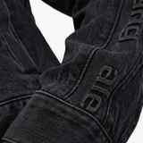 Close up of black jacket, showing texture of the Cotton fabric