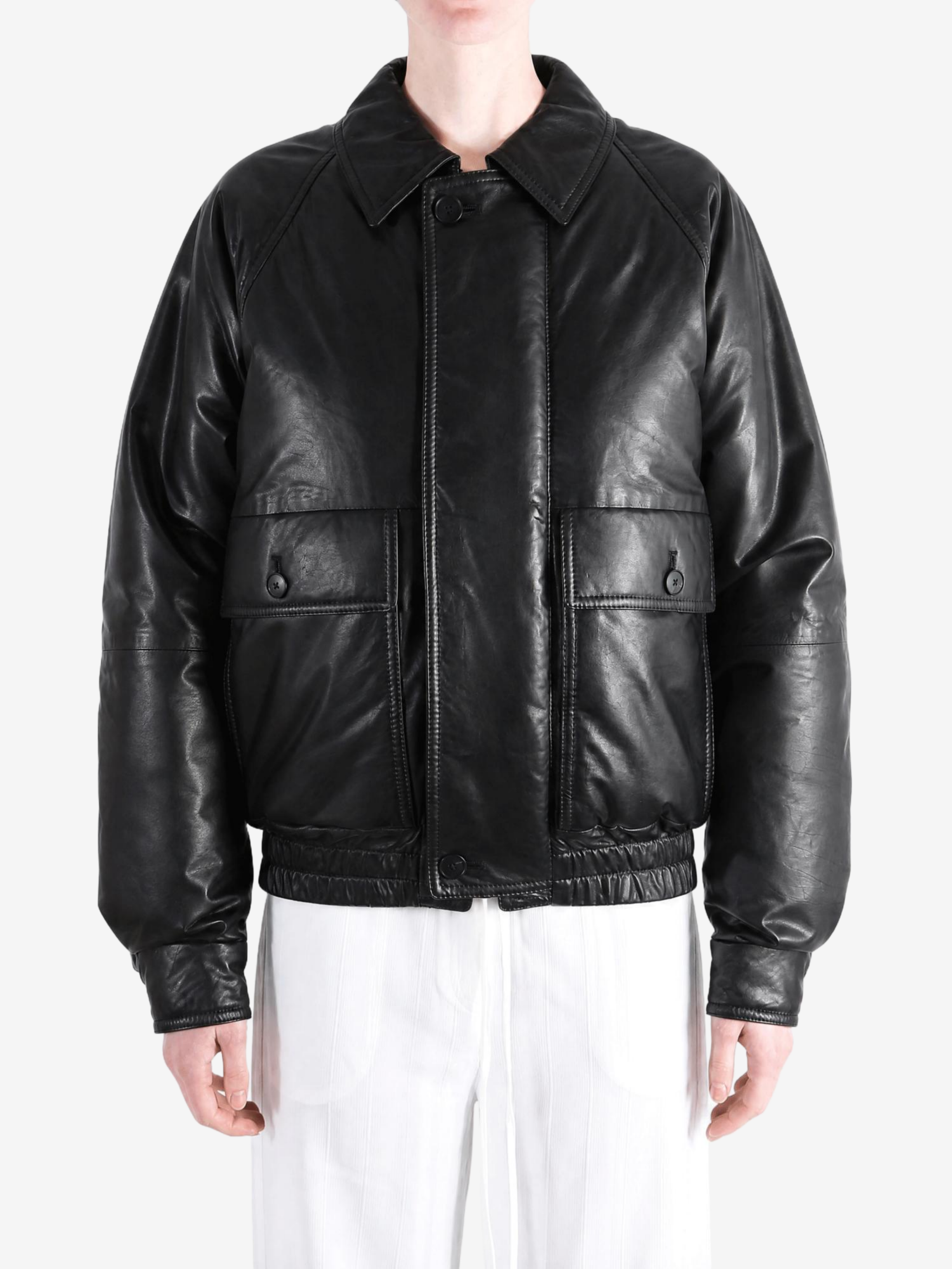 Black jacket worn by a person, showing the jacket fit