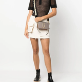 Grey bag worn by a person, showing the bag's fit