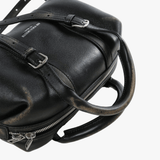 Cloes-up of black bag, showing texture of the lamb leather fabric