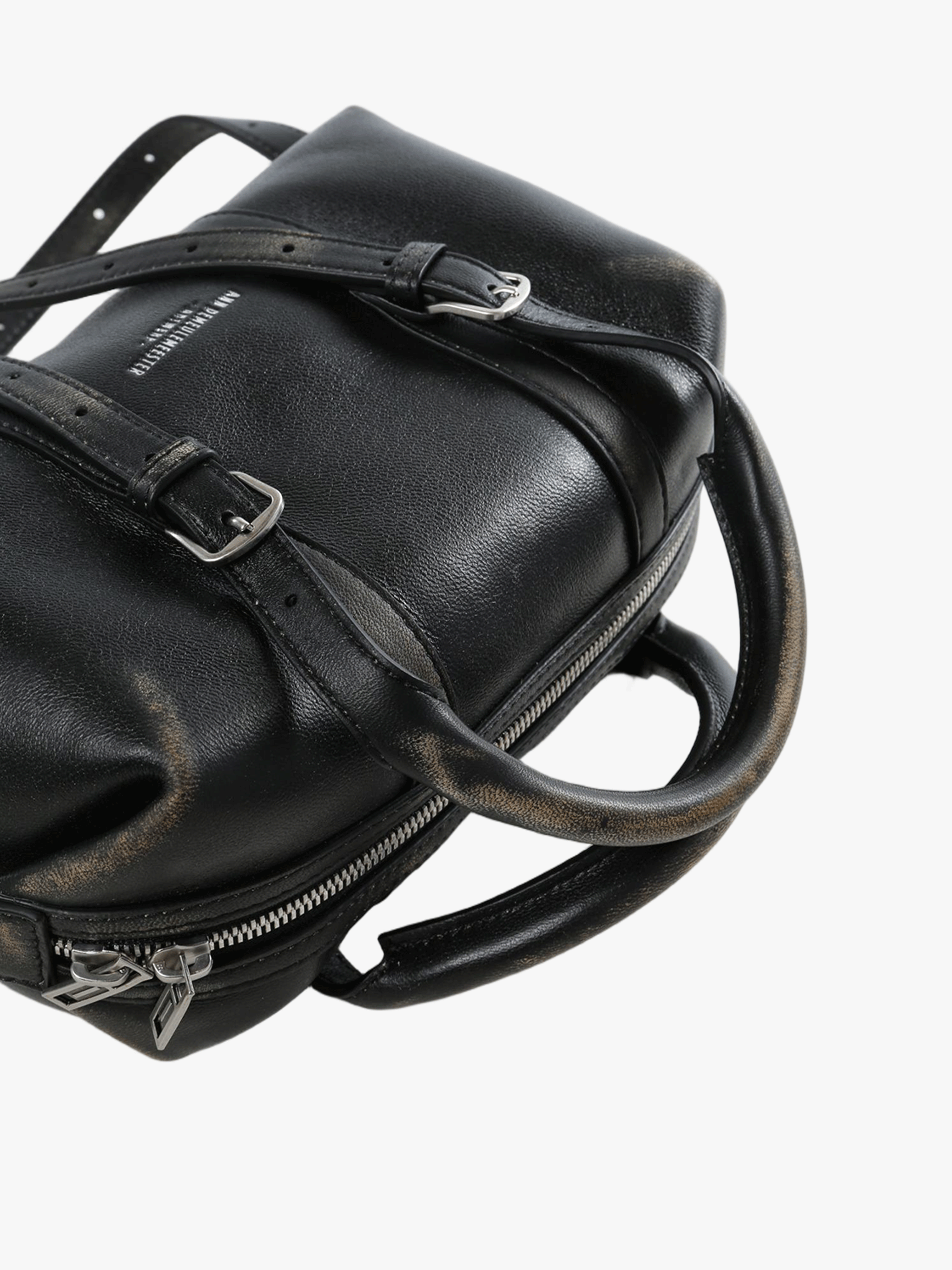 Cloes-up of black bag, showing texture of the lamb leather fabric
