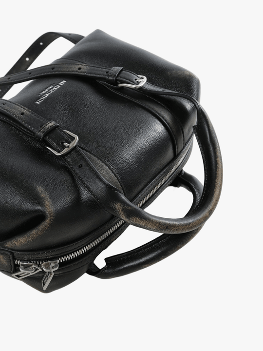 Cloes-up of black bag, showing texture of the lamb leather fabric