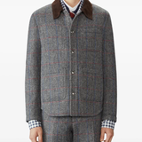 Grey jakcets worn by a person, showing the jackets fit