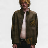 Brown shirts worn by a person, showing the shirts fit