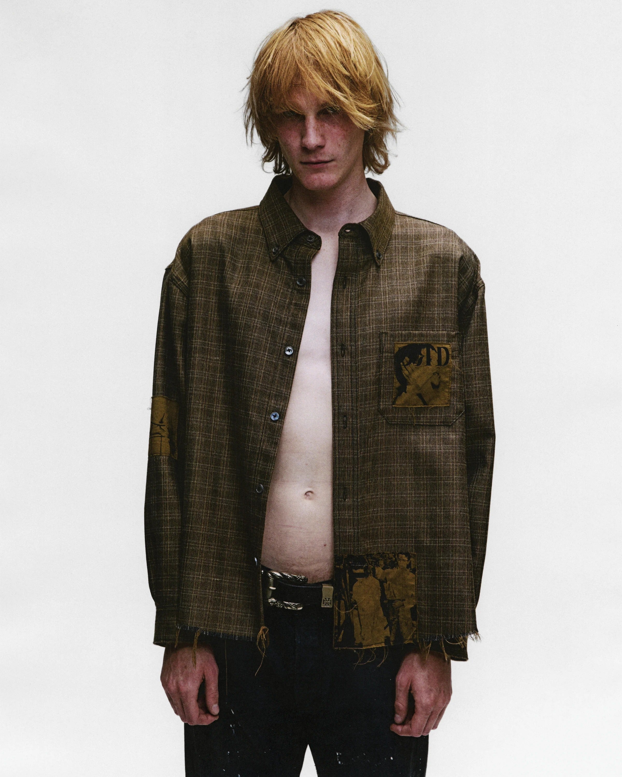 Brown shirts worn by a person, showing the shirts fit