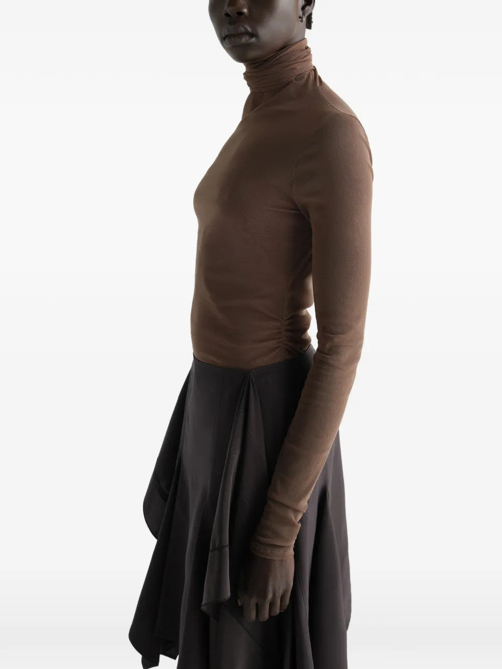 Brown top worn by a person, showing the top fit