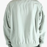 Grey jacket worn by a person, showing the jacket's fit