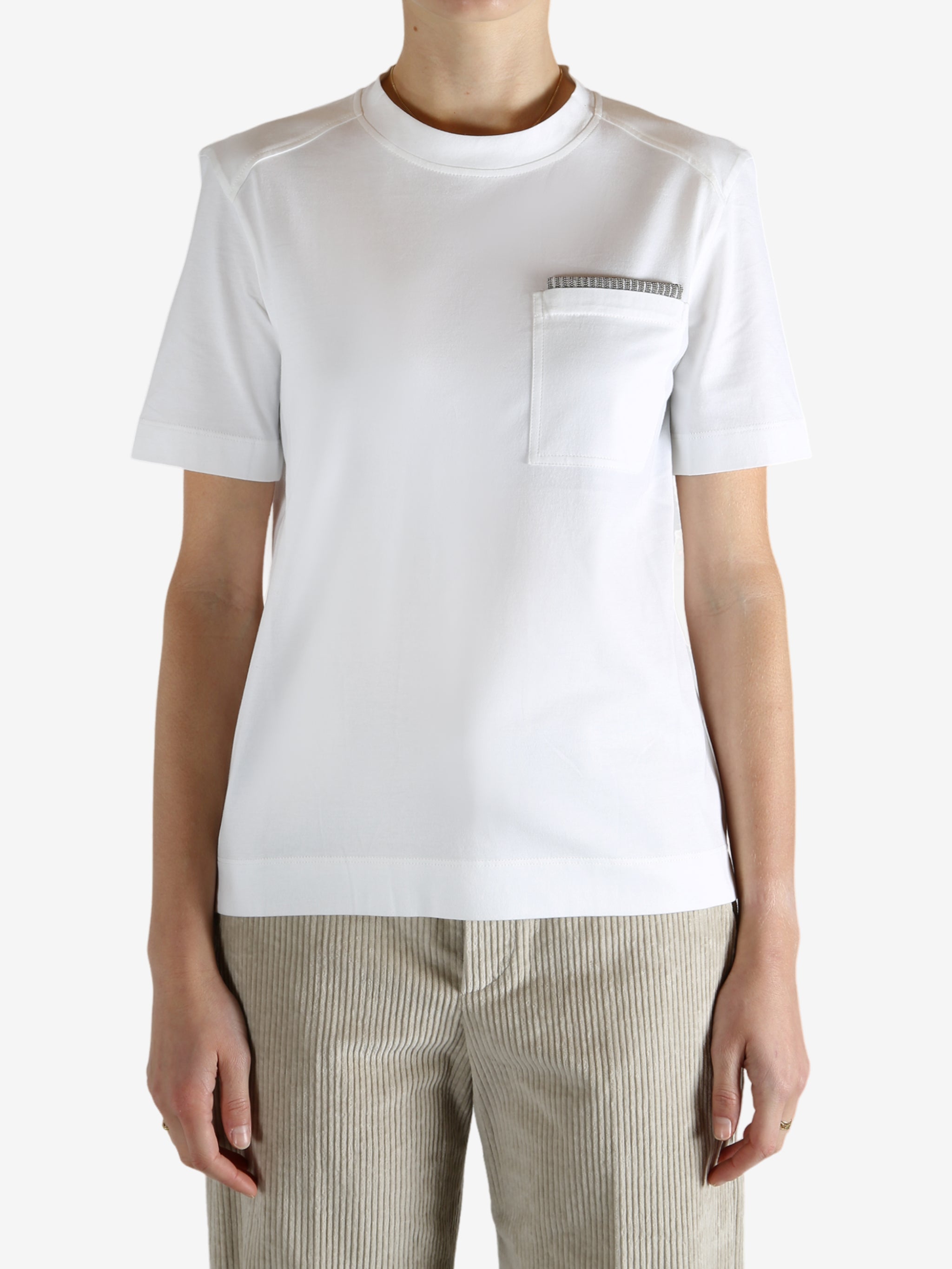 White t-shirt worn by a person, showing the t-shirt fit