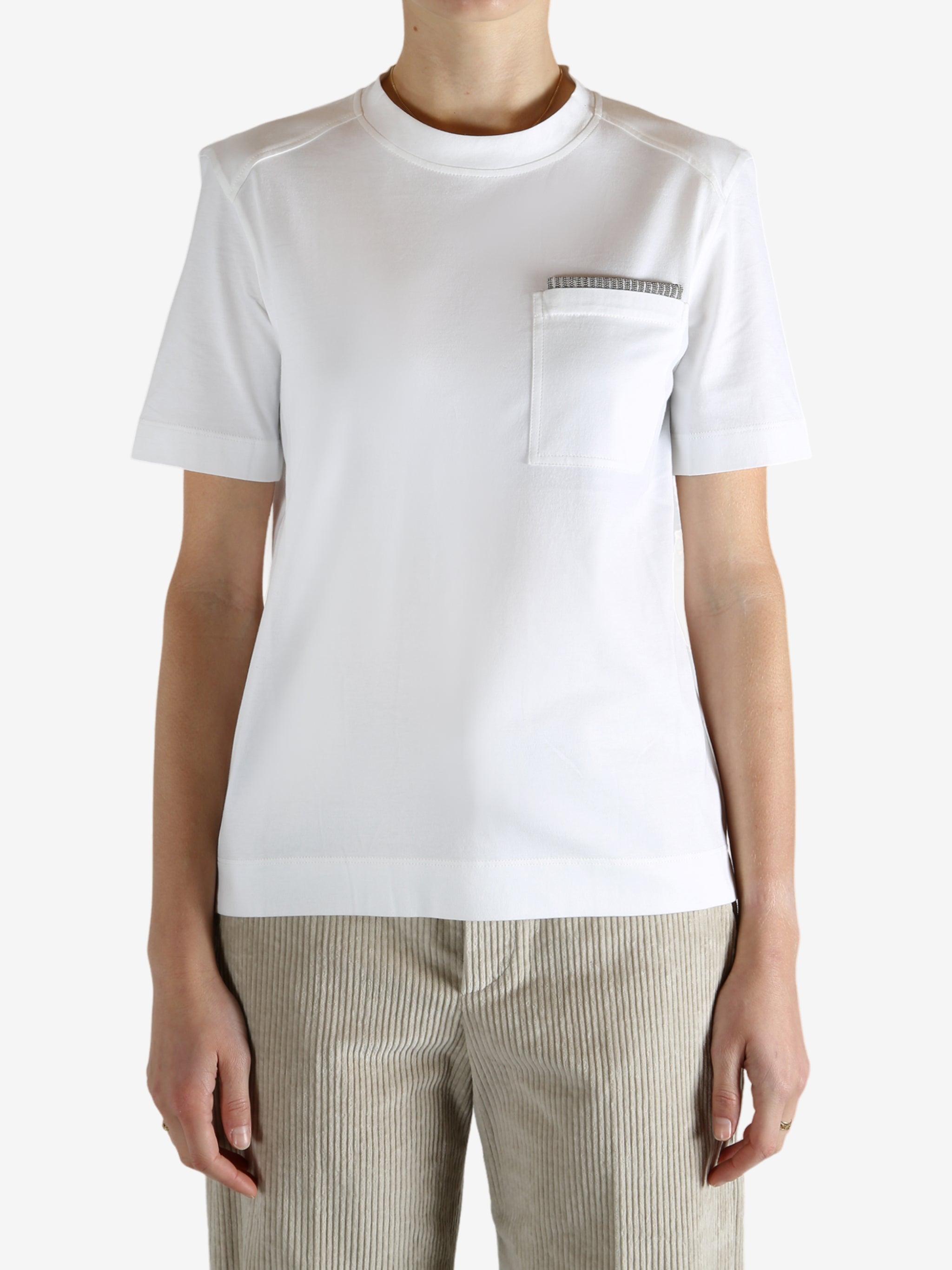 White t-shirt worn by a person, showing the t-shirt fit