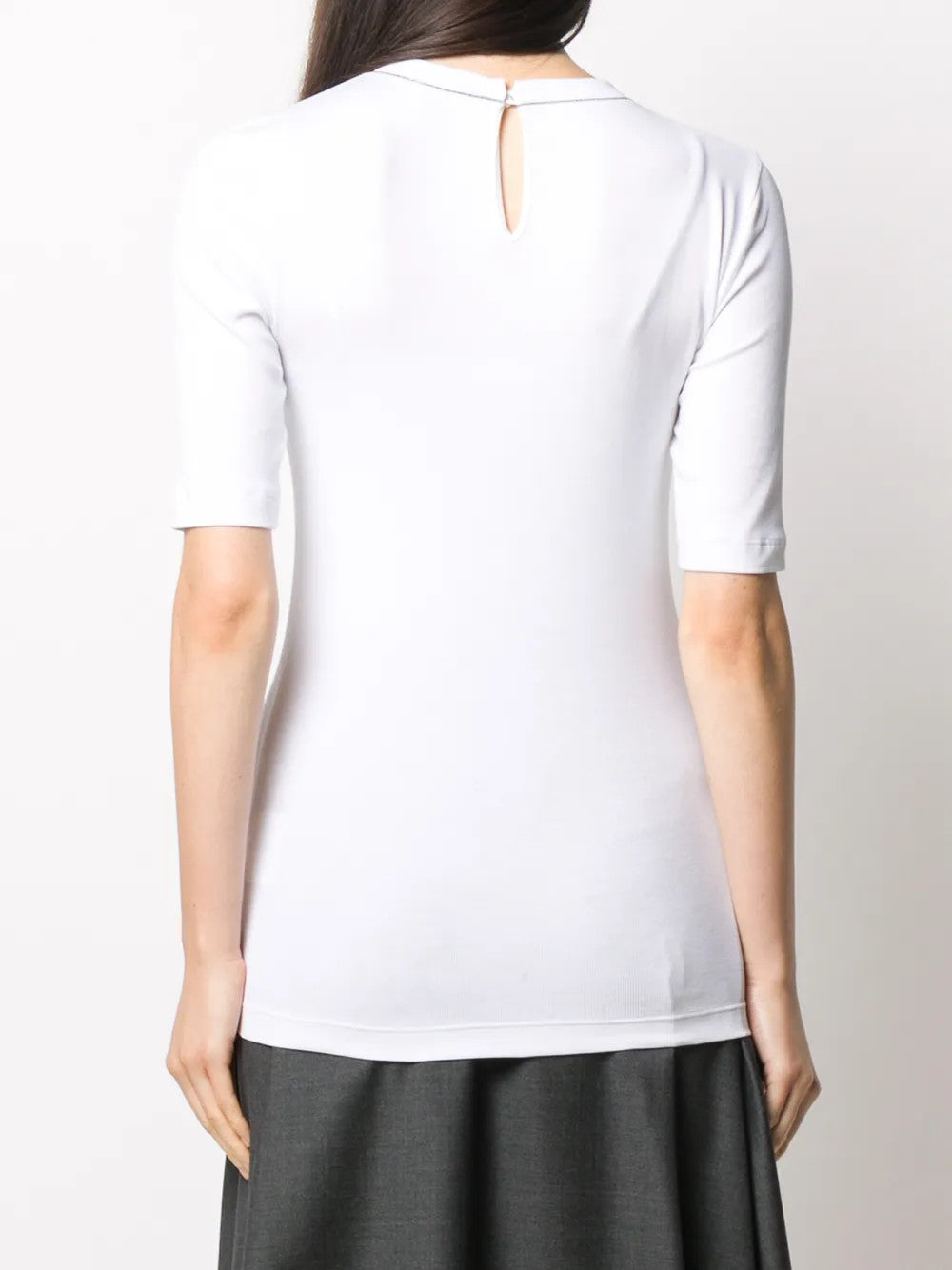 White t-shirt worn by a person, showing the t-shirt fit