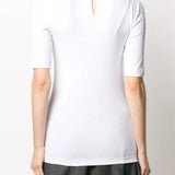 White t-shirt worn by a person, showing the t-shirt fit