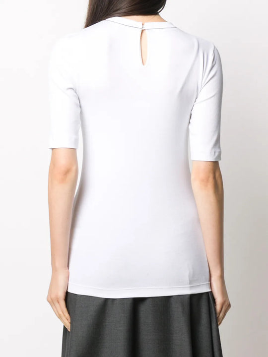 White t-shirt worn by a person, showing the t-shirt fit