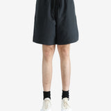 Black shorts worn by a person, showing the shorts' fit