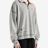 Grey hoodie worn by a person, showing the hoodie fit
