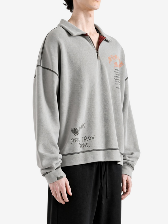 Grey hoodie worn by a person, showing the hoodie fit