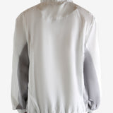 White jacket worn by a person, showing the jacket's fit