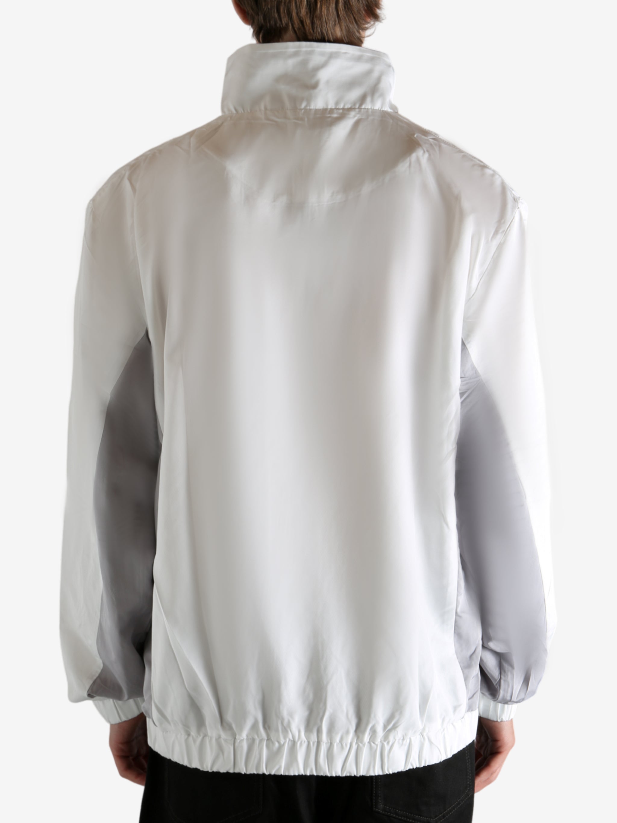 White jacket worn by a person, showing the jacket's fit