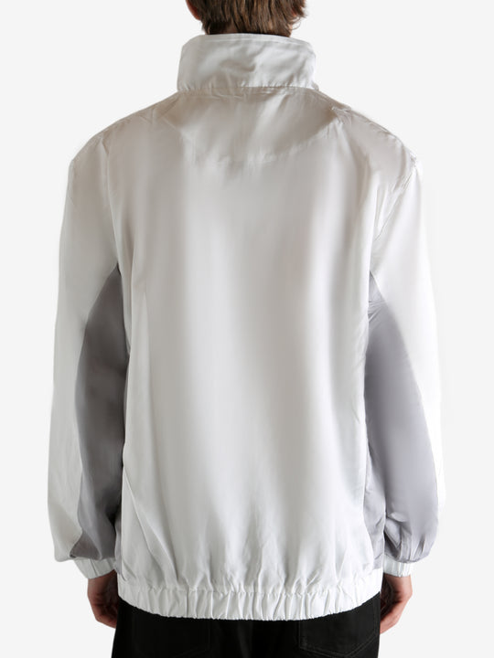 White jacket worn by a person, showing the jacket's fit