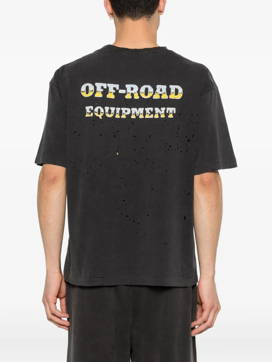 Black t-shirt worn by a person, showing the shirt's fit