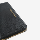 Close up of black wallet, showing texture of the Split Cow Leather fabric