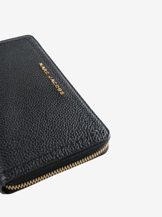Close up of black wallet, showing texture of the Split Cow Leather fabric