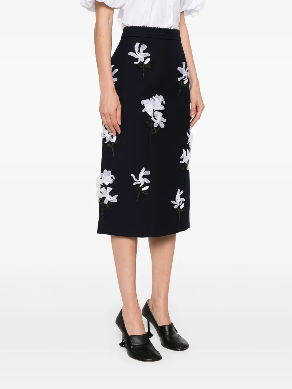 Navy skirt worn by a person, showing the skirt's fit