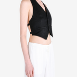 Black top worn by a person, showing the top fit