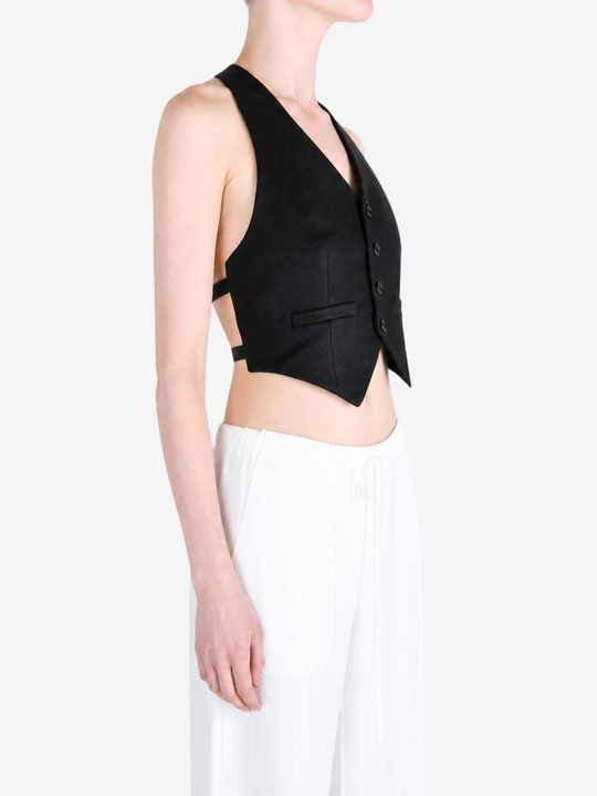 Black top worn by a person, showing the top fit