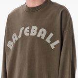 Brown t-shirt worn by a person, showing the t-shirt fit