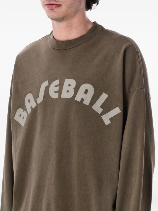 Brown t-shirt worn by a person, showing the t-shirt fit