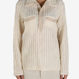 Tan shirt worn by a person, showing the shirt’s fit