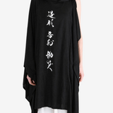 Black dress worn by a person, showing the dress fit
