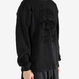 Black t-shirt worn by a person, showing the t-shirt's fit