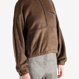 Brown jackets worn by a person, showing the jackets fit