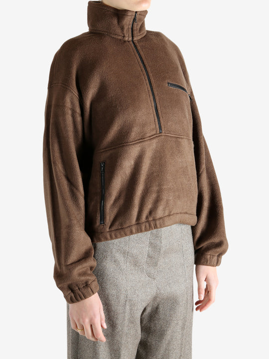 Brown jackets worn by a person, showing the jackets fit