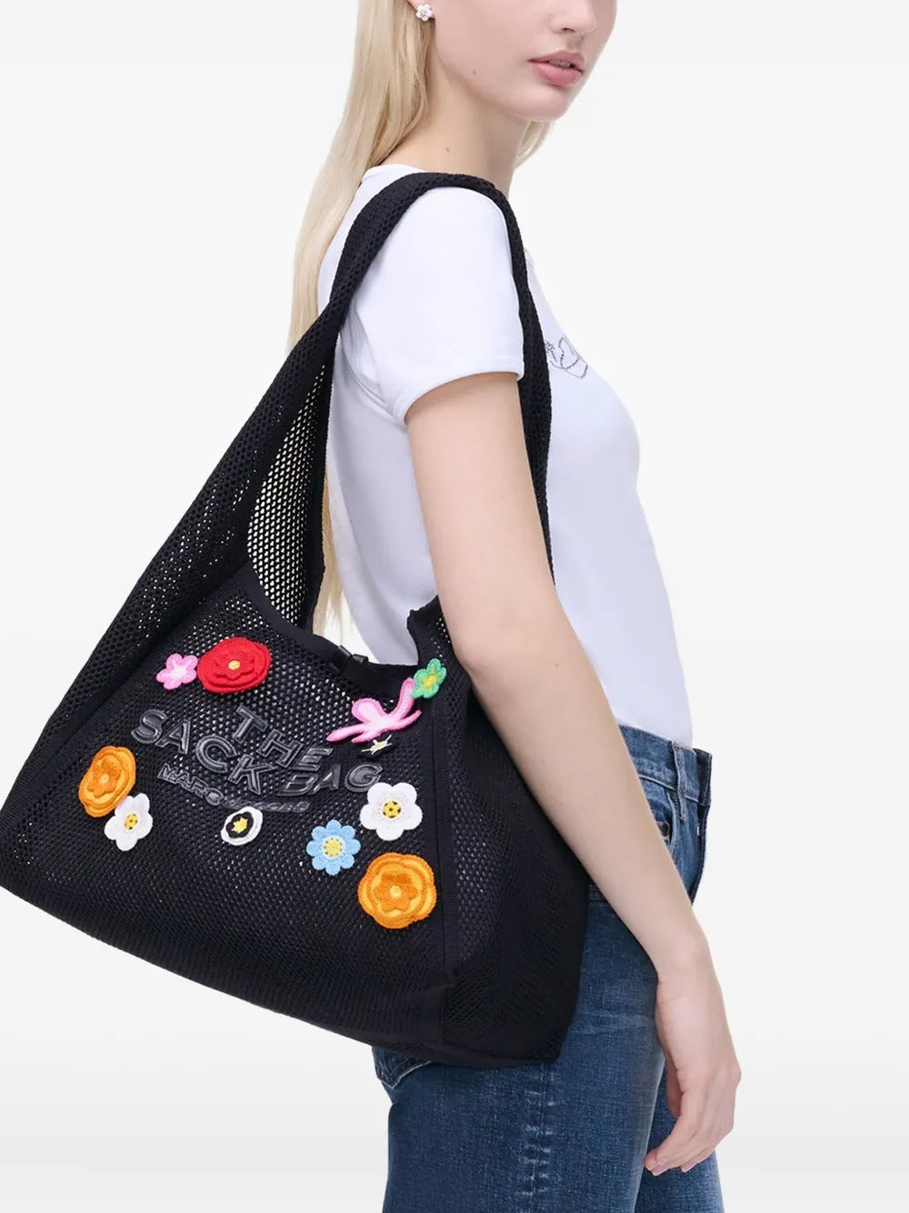 Black bag worn by a person, showing the bag's fit