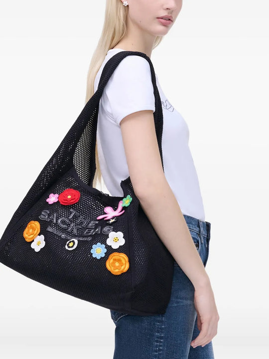 Black bag worn by a person, showing the bag's fit