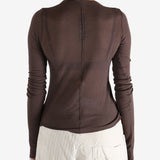 Brown t-shirt worn by a person, showing the t-shirt's fit