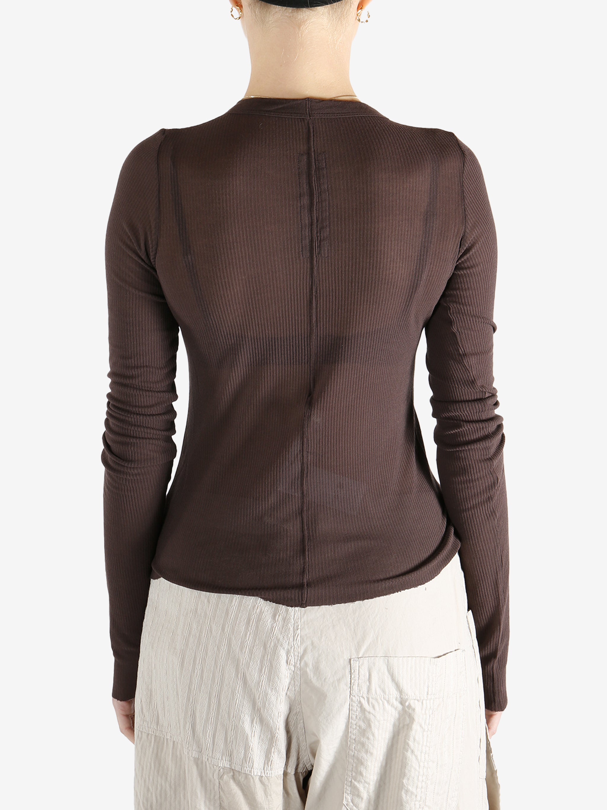 Brown t-shirt worn by a person, showing the t-shirt's fit