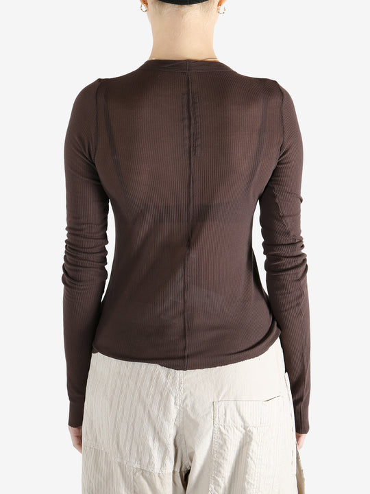 Brown t-shirt worn by a person, showing the t-shirt's fit