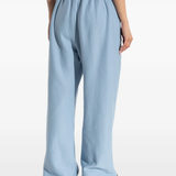 Blue pants worn by a person, showing the pants' fit