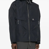 Black jacket worn by a person, showing the jacket's fit