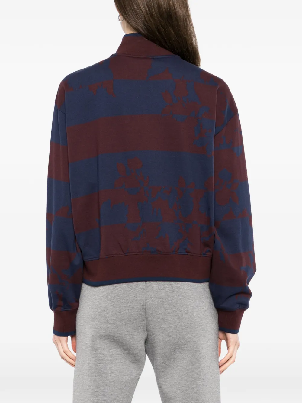 Burgundy sweater,worn by a person, showing the sweater's fit