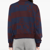 Burgundy sweater,worn by a person, showing the sweater's fit