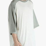 White t-shirt worn by a person, showing the shirt's fit