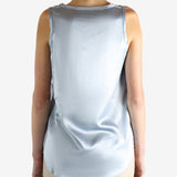 Grey t-shirts worn by a person, showing the t-shirts fit