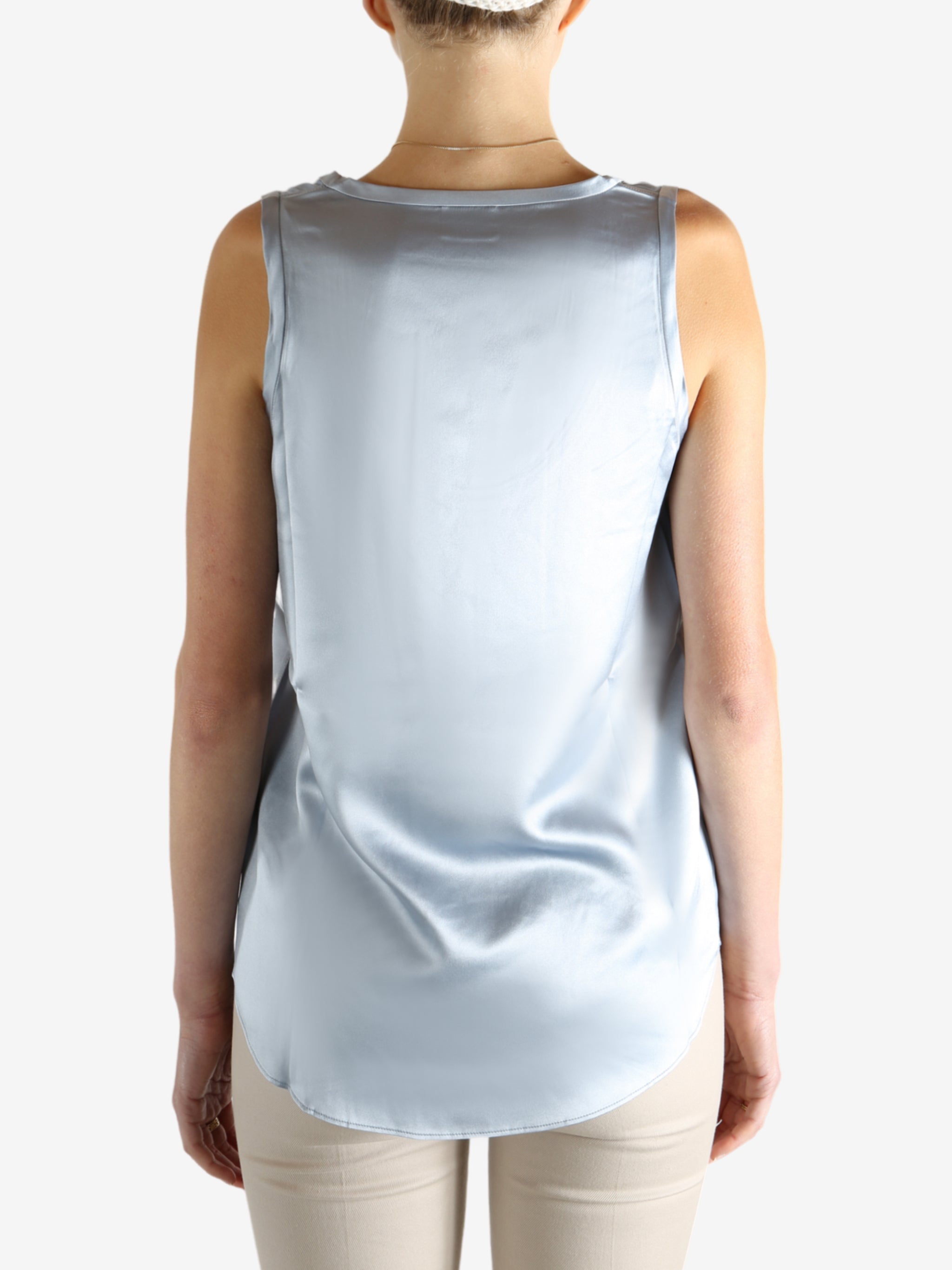 Grey t-shirts worn by a person, showing the t-shirts fit