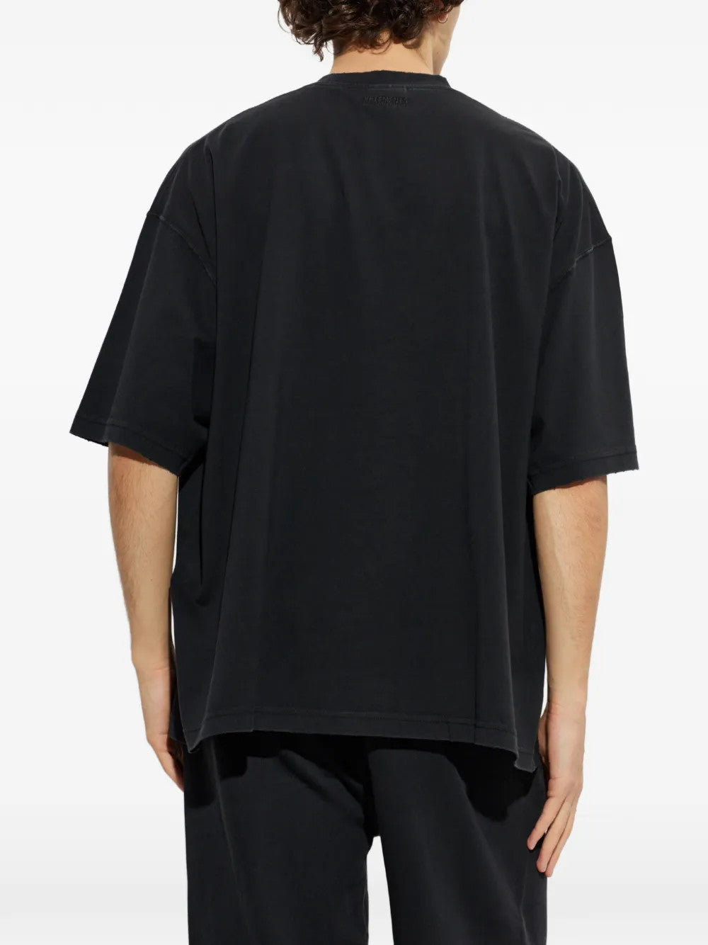 Black t-shirt, full body view