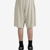 Grey shorts worn by a person, showing the shorts fit